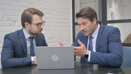 Angry Businessmen in Argument at Workの写真素材