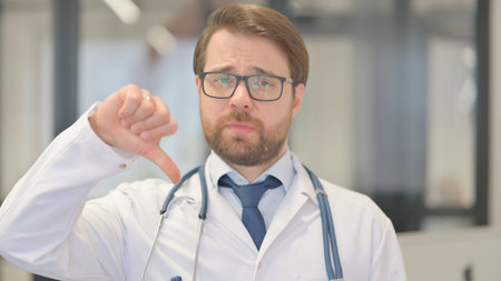 Portrait of Doctor with Thumbs Downの写真素材