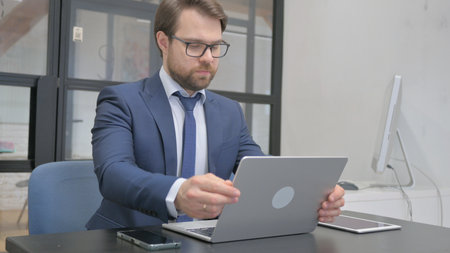 Businessman Coming to Start Work in Officeの写真素材