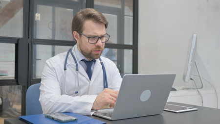 Online Video Chat by Mature Adult Doctorの写真素材