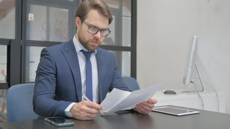 Businessman Feeling Upset with New Contract Resultsの写真素材