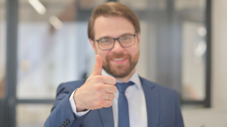 Close Up of Thumbs Up by Businessmanの写真素材