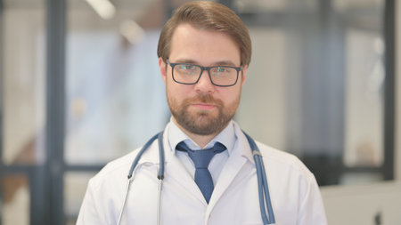 Portrait of Serious Doctor in Clinicの写真素材