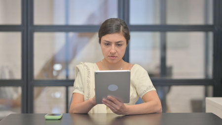 Young Indian Woman Using Digital Tablet
