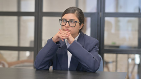 Pensive Mixed Race Businesswoman Brainstorming New Planの写真素材