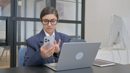 Indian Businesswoman Using Digital Devices for Work