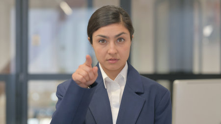 Portrait of Indian Businesswoman Pointing at Camera