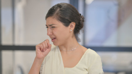 Portrait of Sick Young Indian Woman Coughing