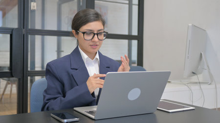 Online Video Chat with Customers by Indian Businesswomanの写真素材
