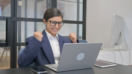 Indian Businesswoman Feeling Happy for Results at Work