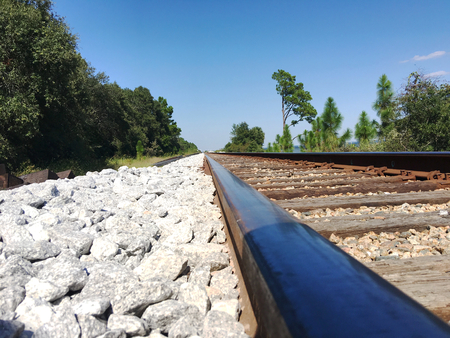 Rusty train tracks on a sunny dayの写真素材