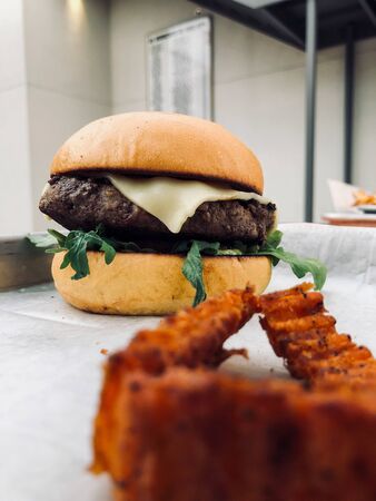 Outdoor cheese burger and potato friesの写真素材