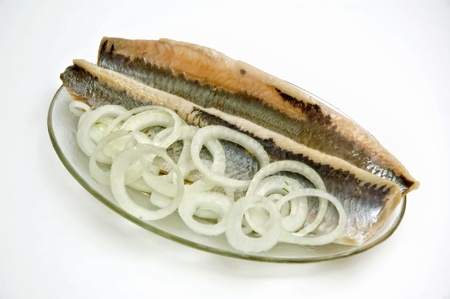 Atlantic herring with onions in a glass dish.の写真素材