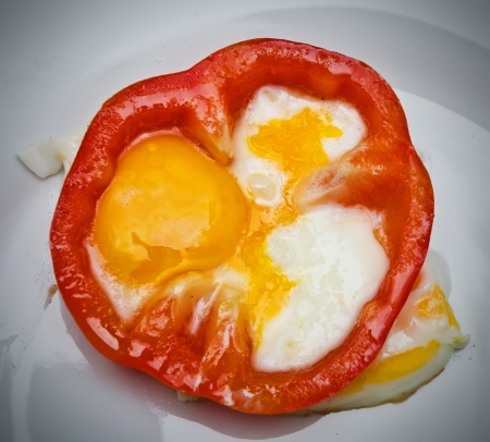 fried eggs with bread and vegetablesの写真素材