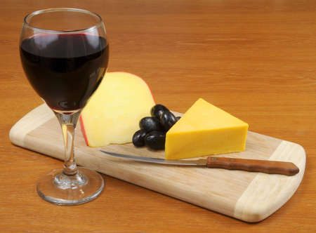Cheese and glass of red wineの写真素材