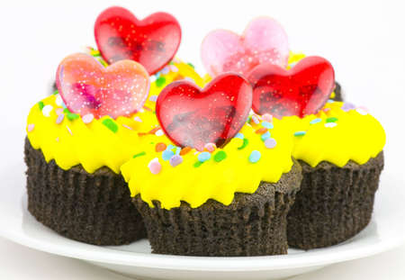 colorful delicious chocolate cupcakes with red heartsの写真素材