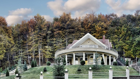 modern vikend house into the colorful forest autumb treesのeditorial素材