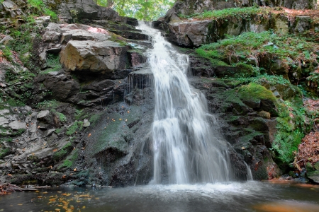 waterfall into forest long exposure backgroundの写真素材