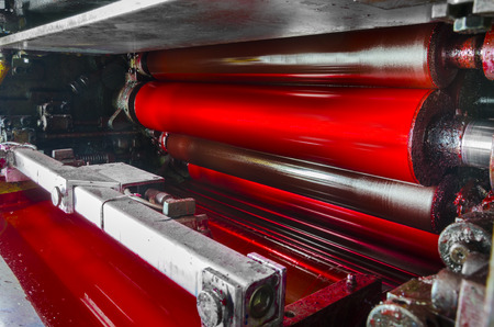 print machine, red magenda color drum, dramatic light