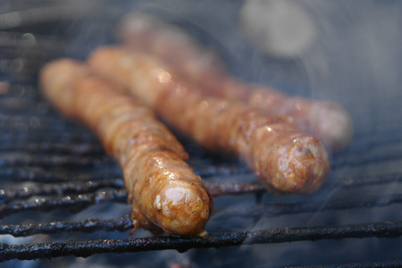 Closeup souseages on hot barbecue, blur smokeの写真素材
