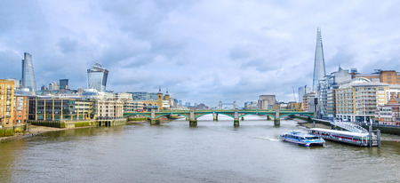 London skyline, United Kingdom - cityscape with modern buildings and Tower of London in autumn under...