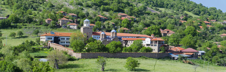 Amazing church monastery complex view through the green tree branches, Lesnovo Macedonia, XIV century landscapeの写真素材
