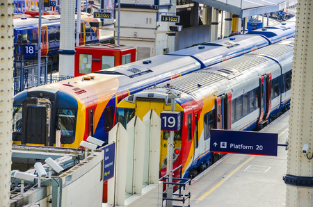 On the platform - Train Station, Modern Commuter Train inside the Waterloo Railway Station in...