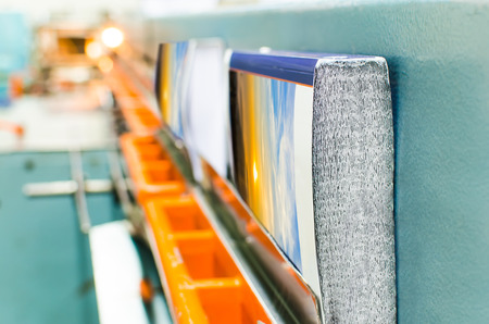 Book, magazine, catalog production line into press plant house. Binding cover and assembling with...