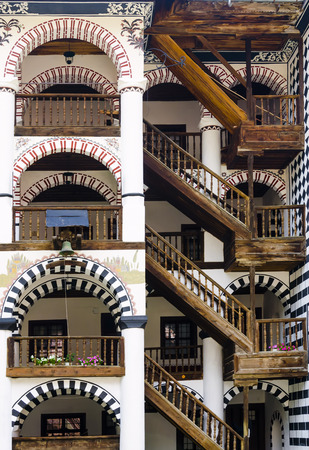 Rila, Bulgaria - portica with timber stairway to rooms in the Unesco World Heritage site Monastery of Saint Ivan of Rila - named Rila monasteryのeditorial素材