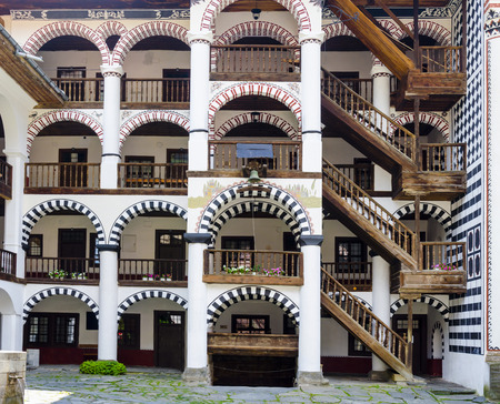 Rila, Bulgaria - portica with timber stairway to rooms in the Unesco World Heritage site Monastery of Saint Ivan of Rila - named Rila monasteryのeditorial素材