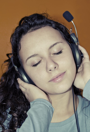 gorgeous young teenage girl enjoing headphone musicの写真素材