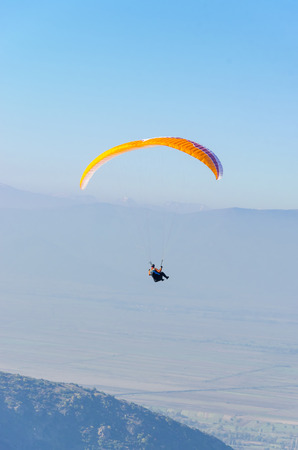 Paraglider at clear blue skyの写真素材
