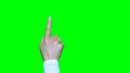 Hand gestures. Touchscreen. Female hand showing multitouch gestures in green screenの写真素材