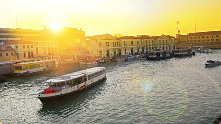 View on Grande Canal and vaporetto water bus traffic from Constitution bridge at sunsetの写真素材