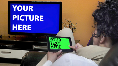 Holding Touchscreen Device, Close-up of female hands using a smart phone. chroma-key, green-screenの写真素材