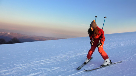Backcountry skier (ski touring), walks up to a snowed mountain ridgeの写真素材