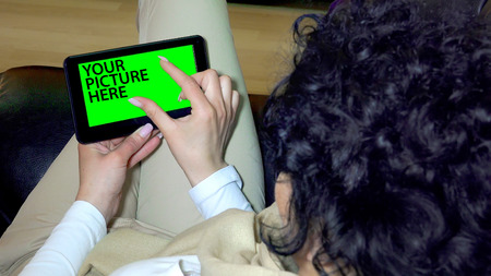 Green screen hands using digital tablet touchscreen device, holding tablet screen touchpad womanの写真素材