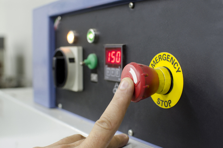 industrial details - hand pressing important technology button at control panel in plantの写真素材