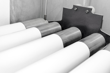Polygraphic process in a modern printing house with rollers and roll print paperの写真素材