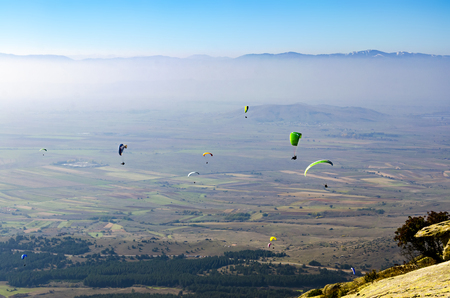 Paraglider. Parachuter. Paragliding in mountainsの写真素材
