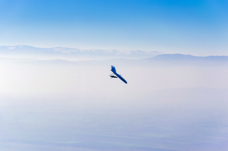 gliders and dramatic foggy sky, aerial pilot povの写真素材
