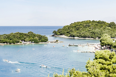 Tropical resort panorama with a green lagoon and trees around the islandsの写真素材