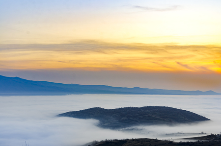 fog and cloud mountain valley landscape at sunset, Macedoniaの写真素材