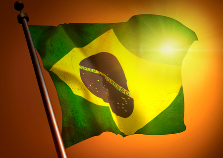 winner waving Brazil flag against the sunsetの写真素材
