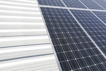 Solar panel produces green, environmentally friendly energy from the sunの写真素材
