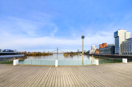 Skyline Dusseldorf, Germany from wooden boardwalk walkway, Bridge and modern buildingsのeditorial素材