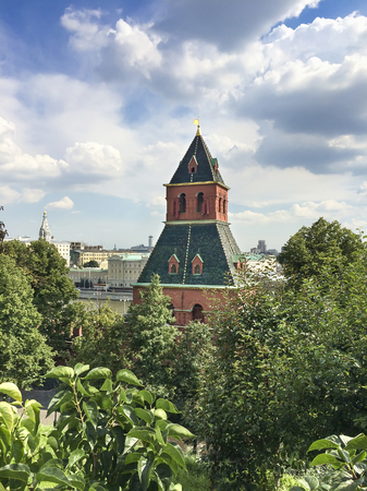Kremlin tower over park trees at the Red Square in Moscow, Russiaの写真素材