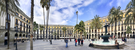 BARCELONA, SPAIN - 19 JAN, 2017: Panorama of  Plaza Real in Barcelona, Spain. The square, with lanterns designed by Gaudi and the Fountain of Three Graces in the center, has a lot of restaurantsのeditorial素材