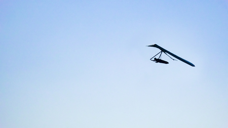 Hang Glider at clear blue skyの写真素材
