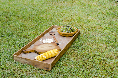 old ethno house table and rug with fruit and vegetableの写真素材